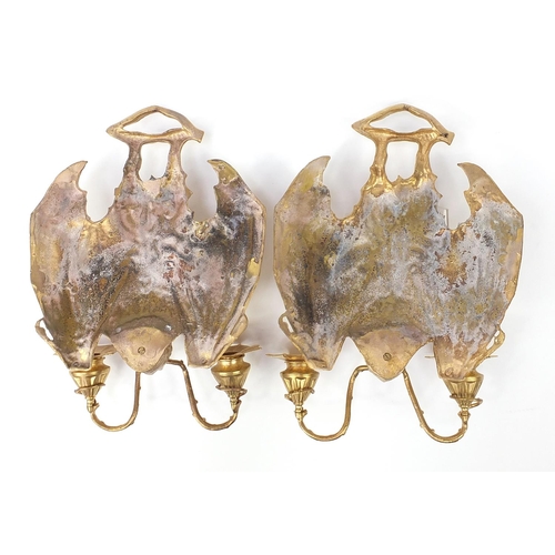 340 - Pair of Art Nouveau style patinated bronze two branch bat design wall sconces, each 36cm high