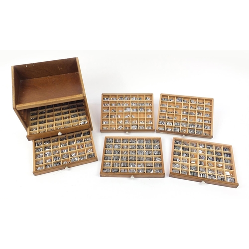 345 - Large collection of metal printer's blocks letterpresses arranged in a six drawer table top cabinet