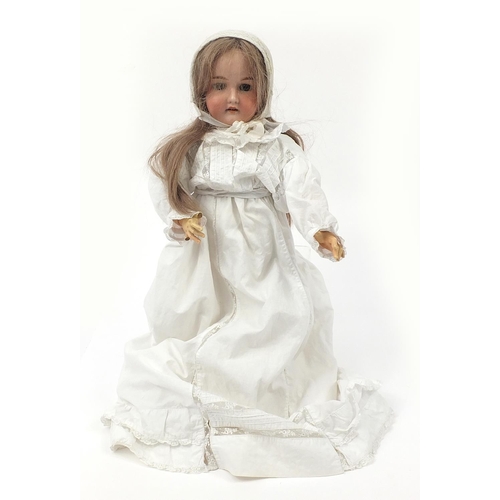 370 - German bisque headed doll with jointed limbs, 62cm in length