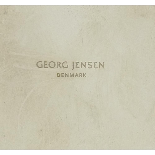 334 - Georg Jensen, graduated set of three Danish candlesticks, the largest 24.5cm high