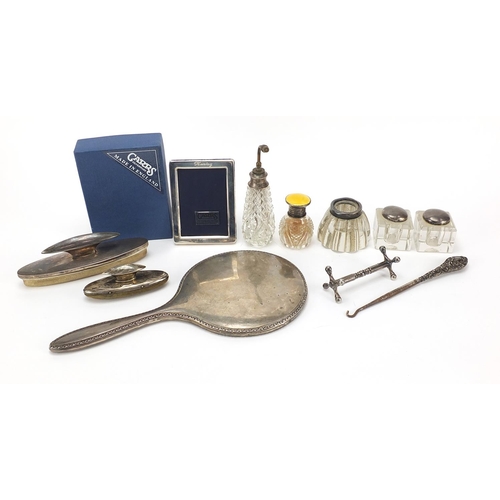 2218 - Edwardian and later silver objects including silver mounted glass ink wells, Carrs easel photo frame... 