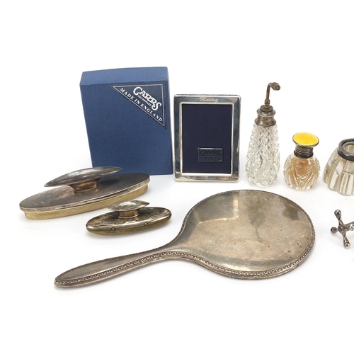 2218 - Edwardian and later silver objects including silver mounted glass ink wells, Carrs easel photo frame... 