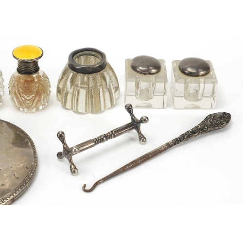 2218 - Edwardian and later silver objects including silver mounted glass ink wells, Carrs easel photo frame... 