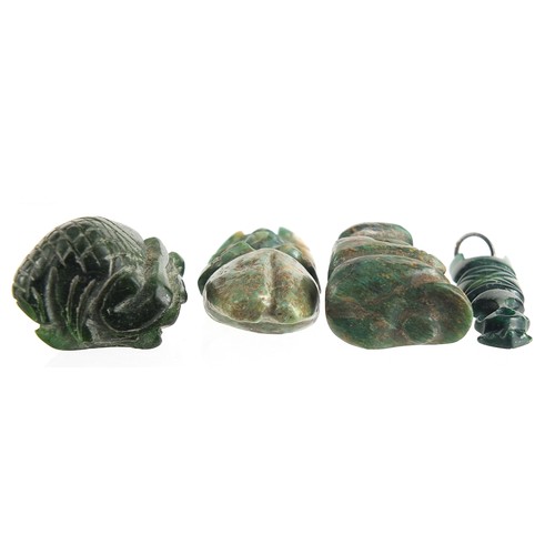 109 - Four antique green stone carvings including a Hei-tiki style pendant, the largest 5.5cm high