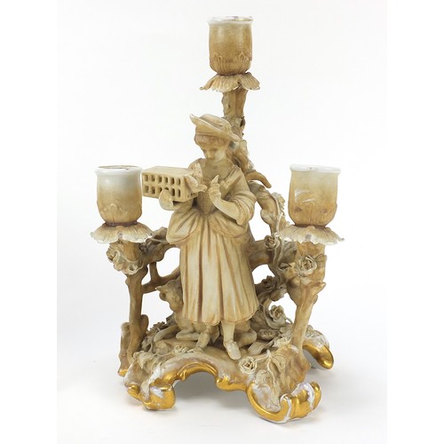 219 - Pair of continental porcelain figural three branch candelabras by Plaue, each 26cm high