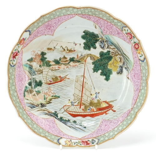 124 - Chinese porcelain plate finely hand painted in the famille rose palette with figures in junks in a r... 