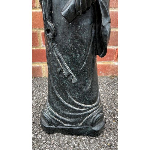 299 - Large Chinese carved green/black stone figure of a standing figure holding a scroll, 69cm high