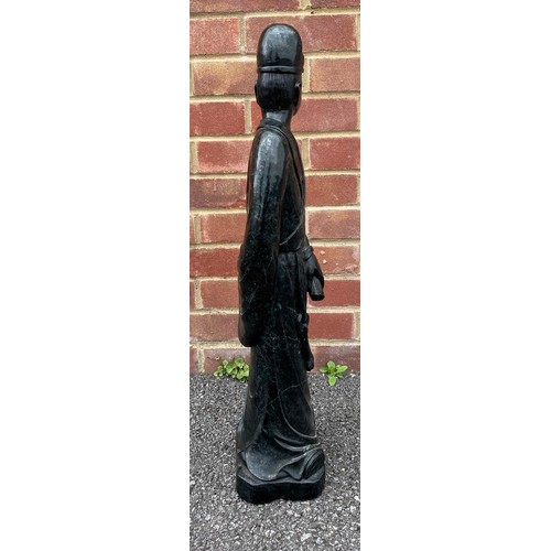 299 - Large Chinese carved green/black stone figure of a standing figure holding a scroll, 69cm high