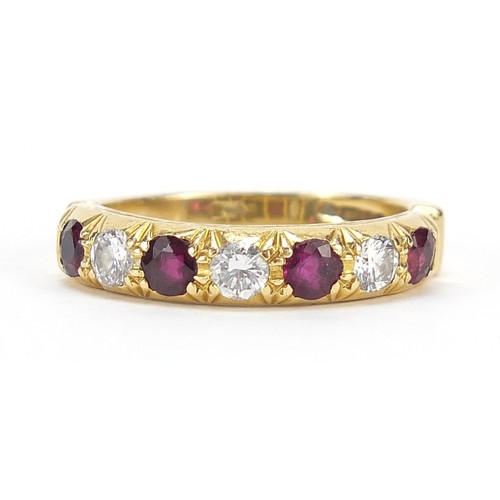 1595 - 18ct gold diamond and ruby half eternity ring, the diamonds approximately 3.2mm in diameter, size R,... 