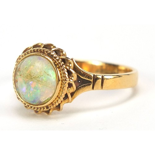 1622 - 18ct gold cabochon opal ring with ornate setting, size L, 3.1g