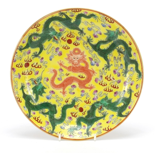 438 - Chinese porcelain shallow dish hand painted with dragons and bats, blue character marks to the base,... 