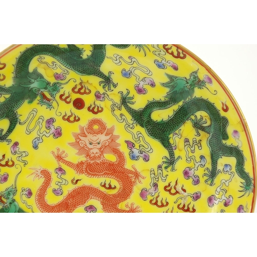 438 - Chinese porcelain shallow dish hand painted with dragons and bats, blue character marks to the base,... 