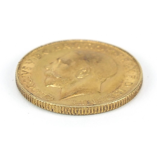 4 - George V 1928 gold sovereign, South African mint - this lot is sold without buyer’s premium, the ham... 