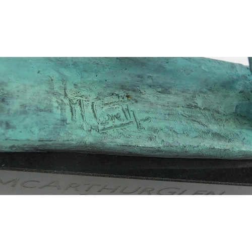 40 - Mark Coreth for McArthur Glen Group, Verdigris bronze study of a winged lion raised on a rectangular... 