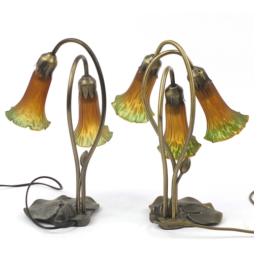 1897 - Two Tiffany design bronzed lily pad lamps with glass shades, 40cm high