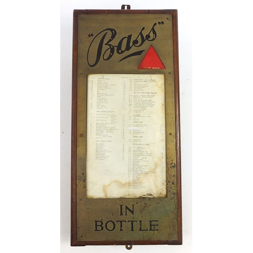 234 - Bass in a Bottle brass and enamel advertising price list, 69cm x 32cm