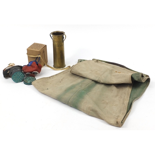 2153 - Militaria including a World War II hammock and gas mask