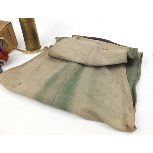 2153 - Militaria including a World War II hammock and gas mask