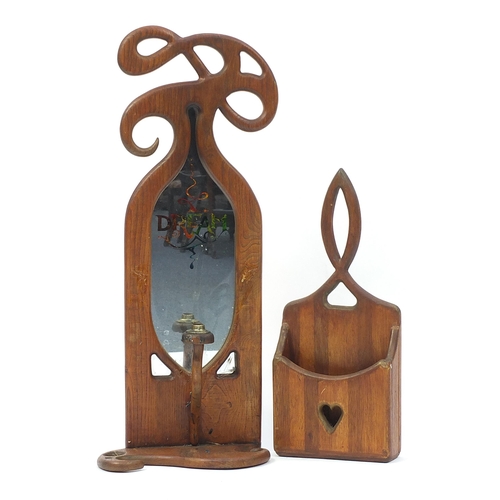 687 - Art Nouveau design oak wall hanging mirrored sconce and wall pocket, the largest 80cm high