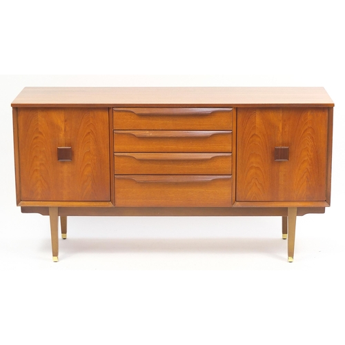 691 - Mid century teak sideboard with a pair of cupboard doors and four central drawers, 74cm H x 140cm W ... 