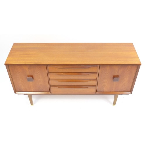 691 - Mid century teak sideboard with a pair of cupboard doors and four central drawers, 74cm H x 140cm W ... 