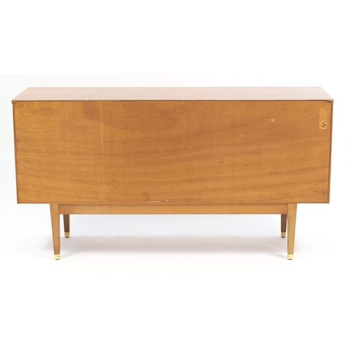 691 - Mid century teak sideboard with a pair of cupboard doors and four central drawers, 74cm H x 140cm W ... 