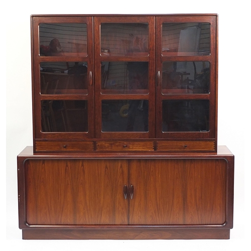 694 - Dyrlund, Danish rosewood wall unit with three glazed doors above two sliding tambour doors, enclosin... 