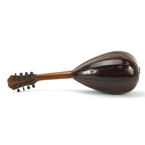 1986 - Rosewood mandolin with mother of pearl and tortoiseshell inlay, bearing a Antonio Grauso label to th... 