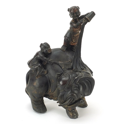 641 - Chinese patinated bronze figure group of two figures washing an elephant, 22cm high