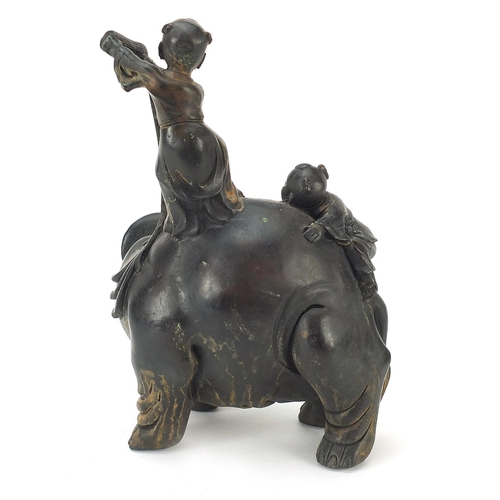 641 - Chinese patinated bronze figure group of two figures washing an elephant, 22cm high