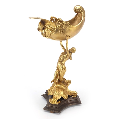 305 - Classical gilt bronze centrepiece in the form of a mermaid holding a shell, 38cm high