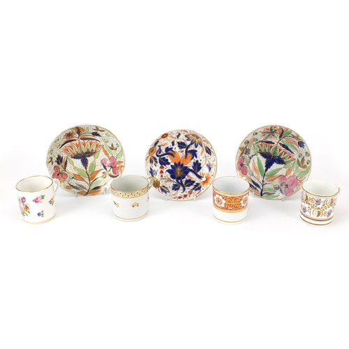 161 - 19th century porcelain comprising four coffee cans and three dishes, each hand painted with flowers,... 