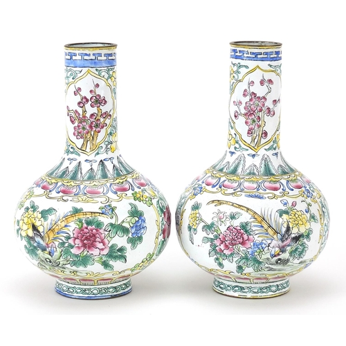 439 - Pair of Canton enamelled vases hand painted with birds of paradise amongst flowers, 15.5cm high