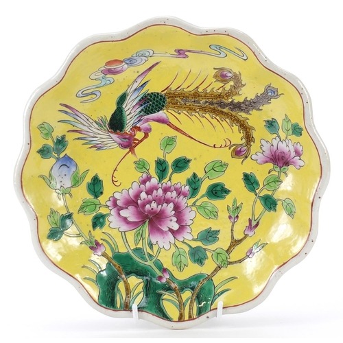 639 - Chinese porcelain yellow ground footed flower head dish, hand painted with a phoenix amongst flowers... 