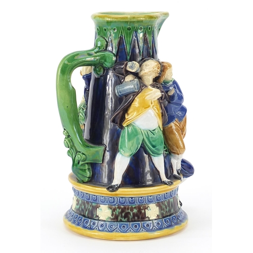 209 - Minton, Victorian Majolica jug decorated in relief with figures, numbered 487 to the base, 24cm high