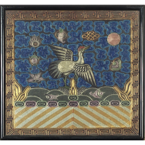 444 - Chinese Civil rank badge embroidered with a crane above waves within a Greek key border, framed and ... 