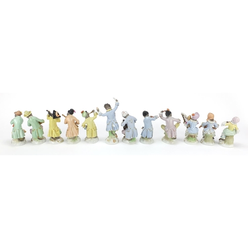 66 - Dresden, set of twelve German porcelain monkey band musicians, each with various numbers to the base... 