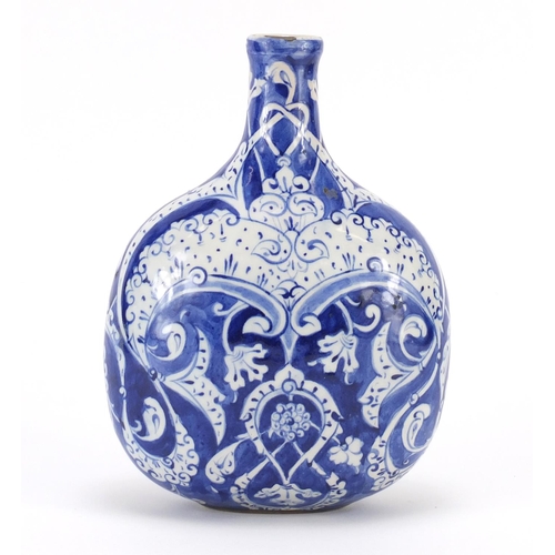 455 - Turkish Iznik pottery water flask, hand painted with stylised flowers and foliage, 20cm high