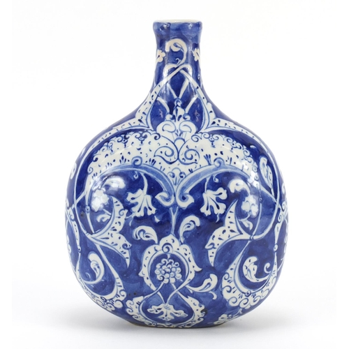 455 - Turkish Iznik pottery water flask, hand painted with stylised flowers and foliage, 20cm high