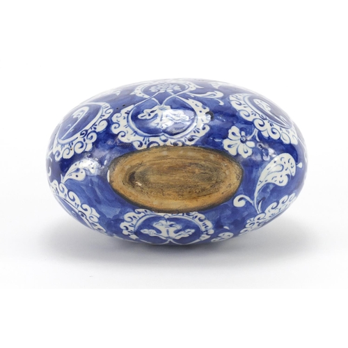 455 - Turkish Iznik pottery water flask, hand painted with stylised flowers and foliage, 20cm high