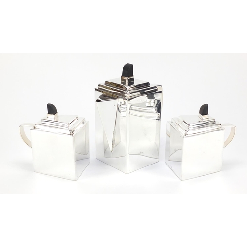 94 - Modernist silver plated tea set on tray in the style of Christopher Dresser with ebonised knops, 38.... 