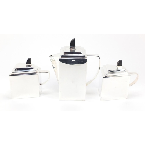 94 - Modernist silver plated tea set on tray in the style of Christopher Dresser with ebonised knops, 38.... 