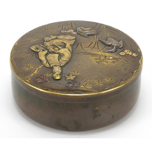 133 - Japanese mixed metal box and cover decorated in relief with a figure and animals, character marks to... 