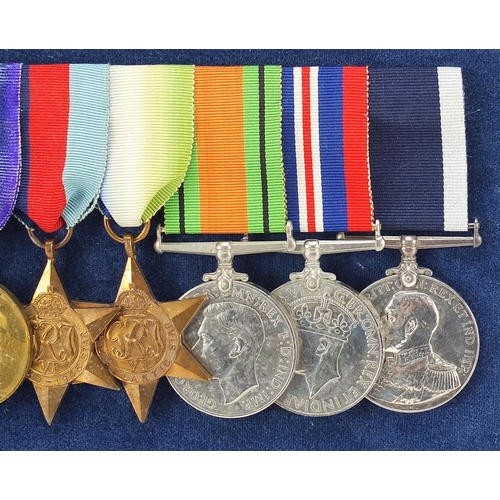 2057 - British military World War I and World War II naval medal group including a World War I trio and Lon... 