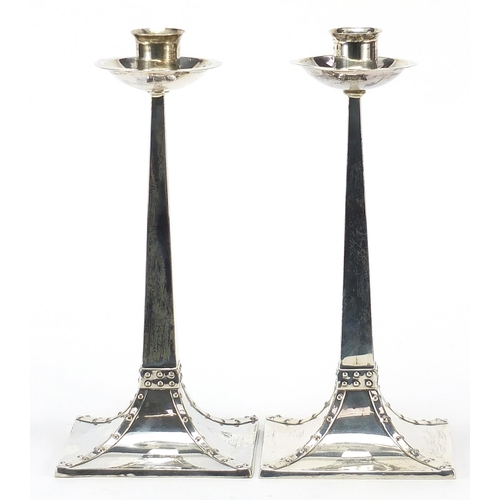 2155 - James Dixon & Sons Ltd, pair of Arts & Crafts silver tapering candlesticks with square bases, Sheffi... 