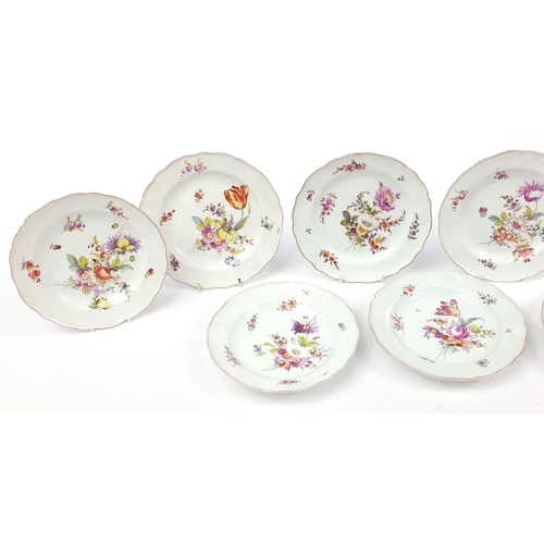 69 - Meissen, nine German porcelain plates hand painted  with flowers, each with blue crossed sword marks... 