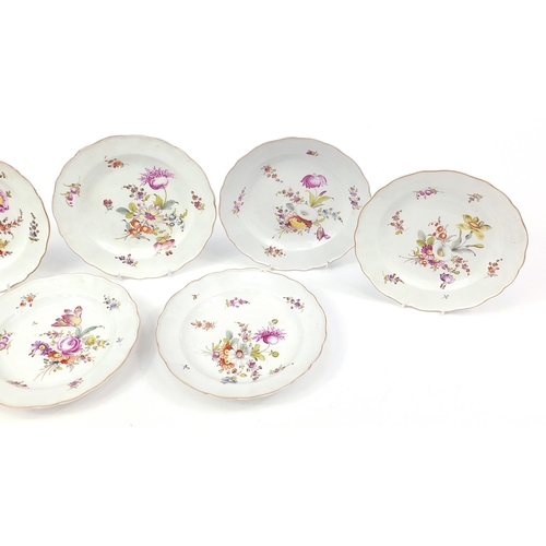 69 - Meissen, nine German porcelain plates hand painted  with flowers, each with blue crossed sword marks... 