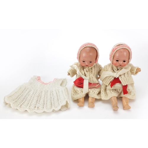 1942 - Two miniature bisque head dolls with open and close eyes, 20cm high