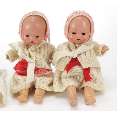 1942 - Two miniature bisque head dolls with open and close eyes, 20cm high