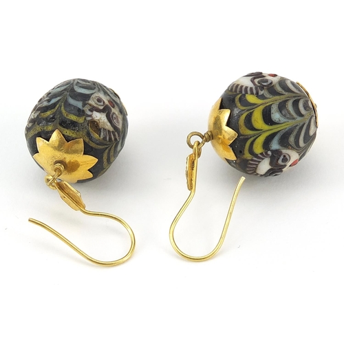 2798 - Pair of Islamic unmarked gold mounted glass earrings, hand painted with face masks, 4cm high, 13.0g